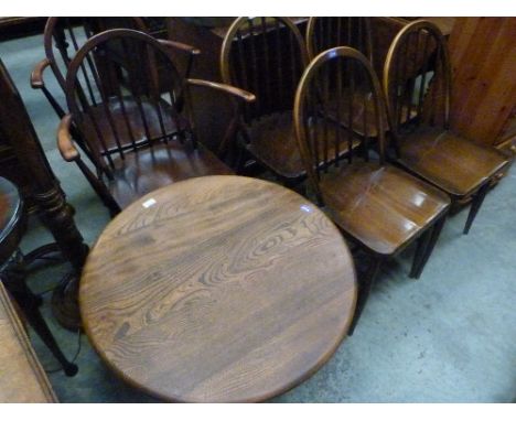 An Ercol low table and a set of six Ercol chairs