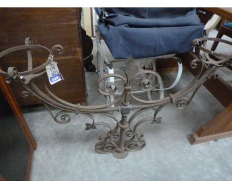 A wrought iron bridge lamp