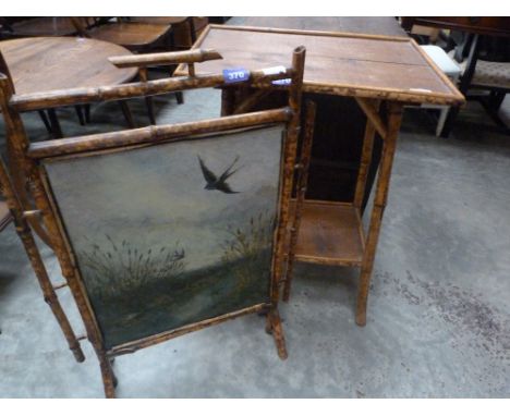 A painted tin and bamboo firescreen and a small bamboo table