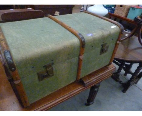 A canvas and wood batten braced cabin trunk