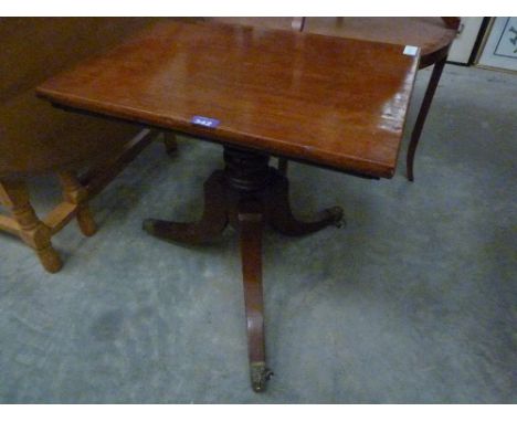 A George III mahogany reading stand with hinged top and tripod support
