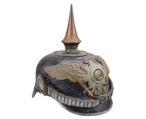 * Pickelhaube. WWI Prussian Pickelhaube, the black leather skull with imperial eagle helmet plate and white metal badge with 