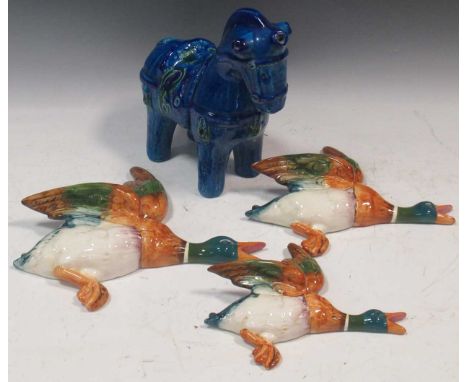 A graduated set of three Beswick flying ducks and a Rimini blue model of a horse attributed to Aldo Londi for BitossiBeswick 