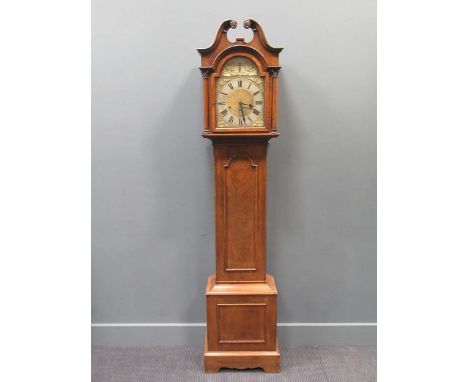 A George III style oak longcase clock with a swan pediment hood, brass arched dial and a chime/silent movement, 193cm high