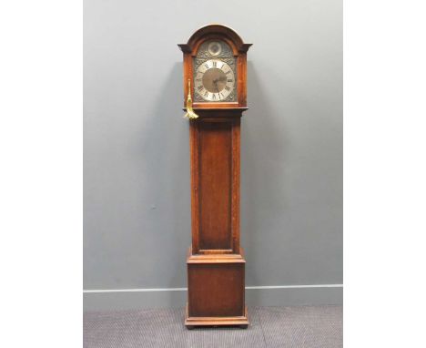 A George III style oak longcase clock with arched hood, the brass dial inscribed St Michael Whittingdon, Westminster chime, 1