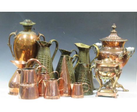 A collection of brass and copper items, to include graduated jugs, a water urn, a samovar and the base to an oil lamp