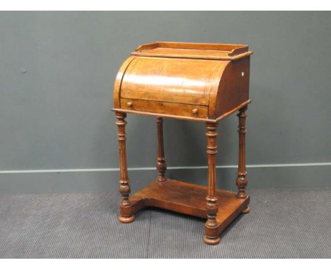 A Victorian walnut cylinder front small desk, with single drawer on turned legs and shelf below, 91 x 58 x 45cm