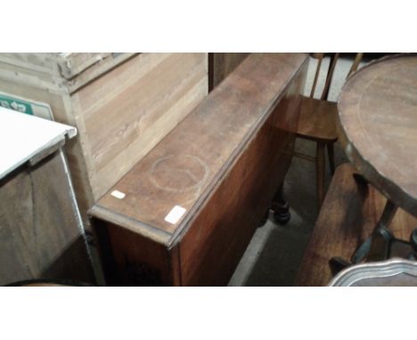 A late Victorian mahogany Sutherland table, AF and an elm seated stick back kitchen chair