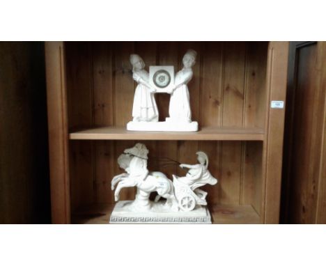 A German figural mantel clock together with a figure group of horse and chariot