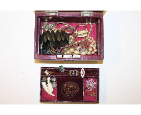 A Victorian red leather jewellery box containing a Masonic ring; various other rings and costume jewellery