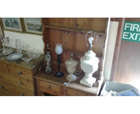 A Chinese soapstone figural table lamp; a crackle glaze lamp and two others