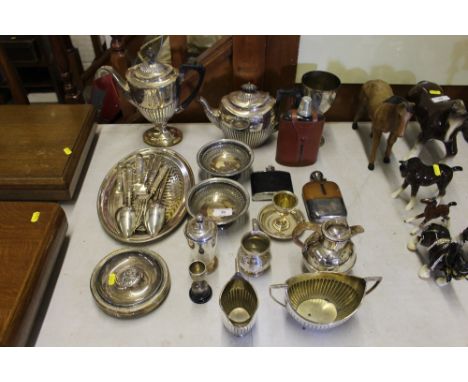 A quantity of silver plated ware to include a Guernsey milk jug; a half fluted teapot and coffee pot; cutlery etc.