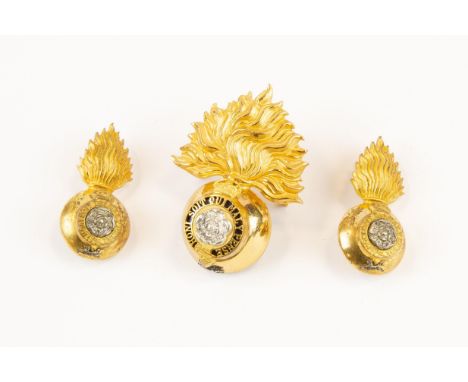 A good Royal Fusiliers officer's gilt, silver and enamel cap badge, VGC, and a pair of matching collar badges. GC, the gilt g