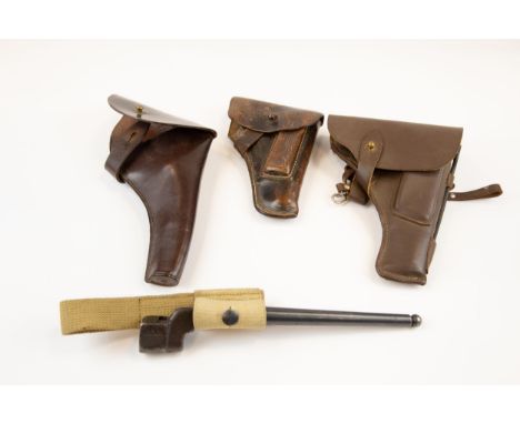 A leather holster for Webley Mk IV Service revolver; another, for Russian Tokarev automatic pistol; another, for Walther Mode