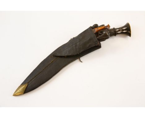 A kukri, blade 12", the hilt of horn with carved band inset with aluminium plaques, and with flat brass pommel, in its leathe