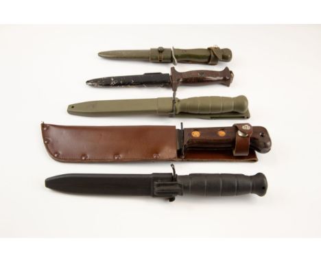 A Wilkinson survival knife c 1970, 2 German combat knives; 2 other Continental survival knives. All with scabbards and VGC £7
