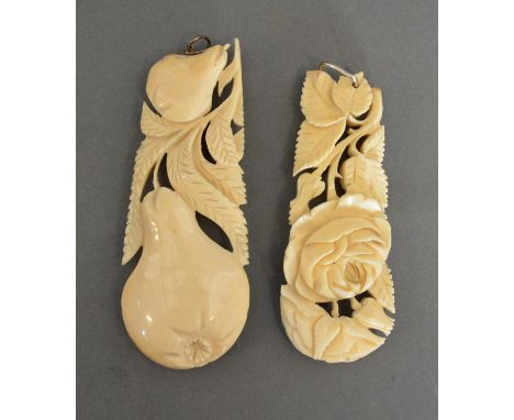 A Late 19th To Early 20th Century Chinese Carved Ivory Large Pendant, together with another similar, 9.5cm long 