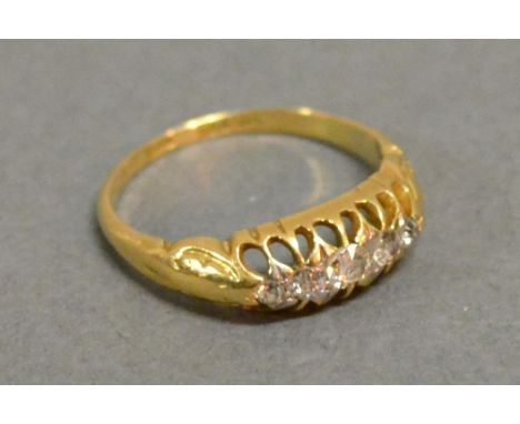 An 18ct. Yellow Gold Five Stone Diamond Ring with five graduated stones within a pierced setting 