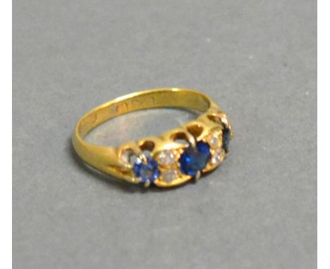 A 9ct. Gold Sapphire And Diamond Ring, three sapphires inter-spaced with diamonds within a pierced setting 