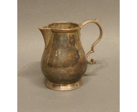 A George II Cream Jug With Shaped Handle, London 1734, maker Robert Lucas, 7cm tall 