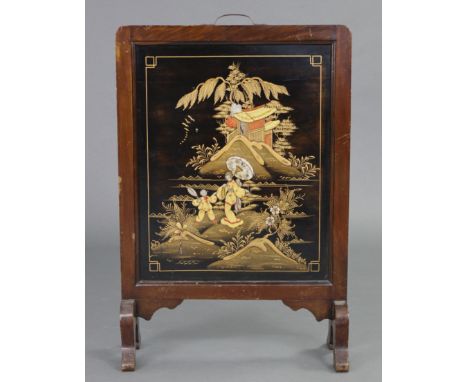An early-mid 20th century Japanese firescreen, inset lacquer panel decorated with figures in a landscape, with brass carrying
