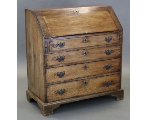 A late 18th/early 19th century walnut bureau, with sloping fall-front enclosing fitted interior, above four long graduated dr