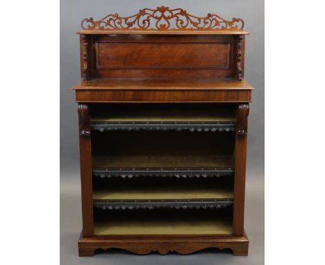 An early Victorian walnut open bookcase, the raised back with pierced fretwork supports, fitted three adjustable shelves, &am