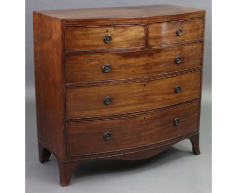 A regency mahogany bow-front chest, fitted two short &amp; three long graduated drawers with brass ring handles, with ebonise