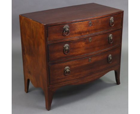 An early 19th century mahogany small bow-front chest with ebonised string inlay, fitted three graduated drawers with brass li