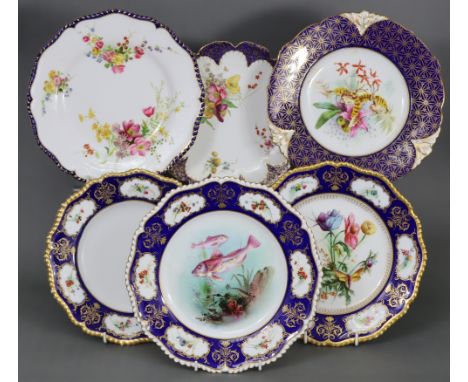 A group of six Royal Worcester cabinet plates most with shaped gadrooned gilt rims, blue borders, &amp; painted decoration; t