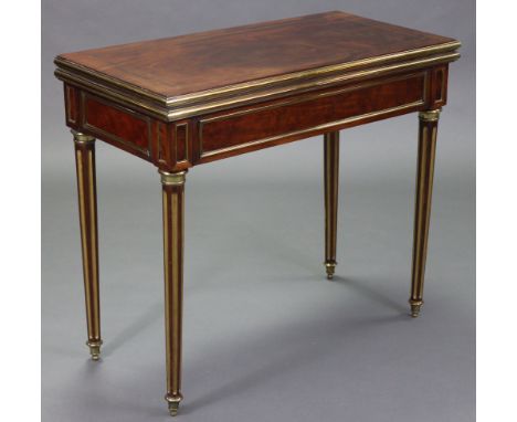 A 19th century French mahogany, brass-mounted &amp; parcel-gilt card table with rectangular fold-over top, inset later green 