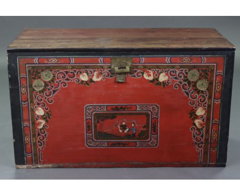 A Chinese painted wooden trunk, decorated to the front with a romantic figure scene in a reserve surrounded by blossoms &amp;