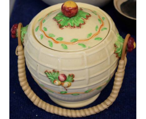 1930s biscuit barrel made by Wilkinson in the style of Clarice Cliff, the biscuit barrel with wicker handle and acorn knop, 1