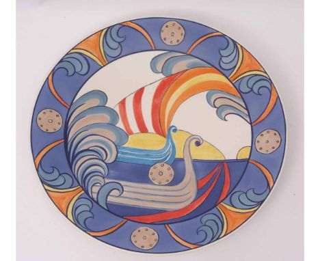 Large Poole Pottery charger by Karen Brown, decorated with Viking ships within a polychrome geometric border, the base with f