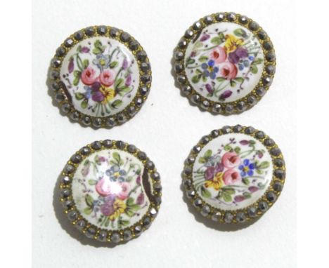 Group of four late 19th century gilt buttons, the centres with enamel decoration painted with floral sprays (4)