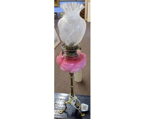 Victorian oil lamp, clear and etched glass shade over a pink glass font raised on a candlestick type support (now converted t