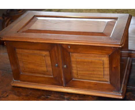 Unusual mahogany possible shoe-shine cabinet, lifting lid and opening doors enclosing six fitted doors with shelf over, 56cm 