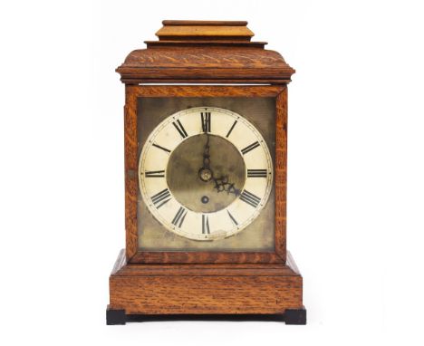 A LATE 19TH CENTURY OAK CASED BRACKET CLOCK with caddy top above a brass dial and single keyhole winding mechanism. 36cm high