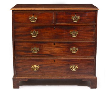 AN EARLY 19TH CENTURY MAHOGANY CHEST OF TWO SHORT AND THREE LONG DRAWERS standing on bracket feet, 105cm wide x 54.5cm deep x