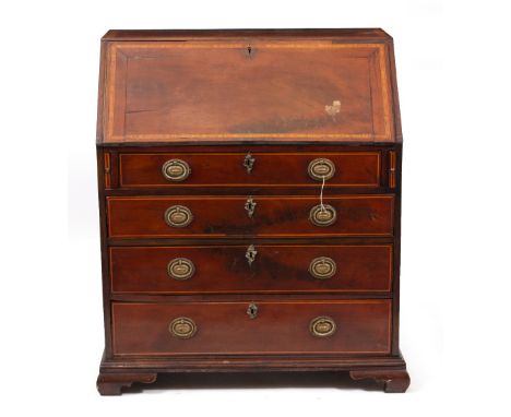 A GEORGE III MAHOGANY AND SATINWOOD CROSS BANDED BUREAU the fall front opening to reveal drawers and pigeon holes above four 