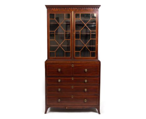 A REGENCY MAHOGANY SECRETAIRE BOOKCASE with glazed doors to the upper section enclosing adjustable shelves over a secretaire 