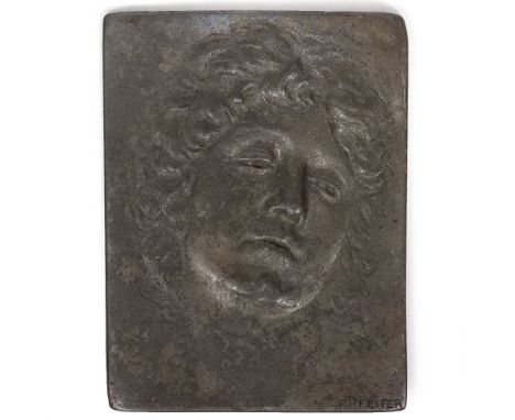 FELIX GEORG PFEIFER (1871-1945) Head and shoulder portrait of a young woman, relief sculpture cast in pewter, signed lower ri