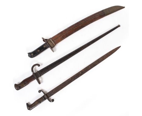 AN OLD LATE 19TH OR EARLY 20TH CENTURY SHORT SWORD with riveted grip and complete with leather and brass mounted scabbard, th