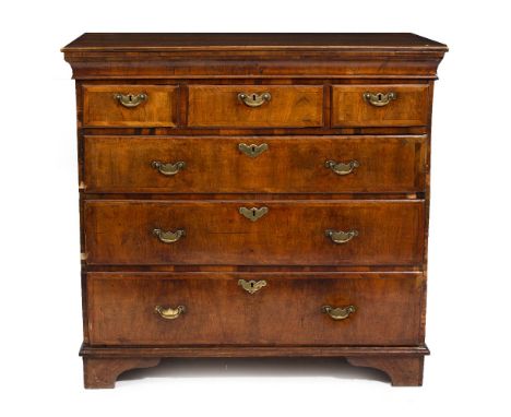 AN ANTIQUE WALNUT CHEST OF THREE SHORT AND THREE LONG DRAWERS standing on bracket feet, 101.5cm wide x 51cm deep x 96cm high 
