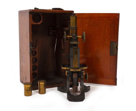 A LATE 19TH / EARLY 20TH CENTURY MICROSCOPE by Swift &amp; Son of Tottenham Court Road, London, with course and fine focusing