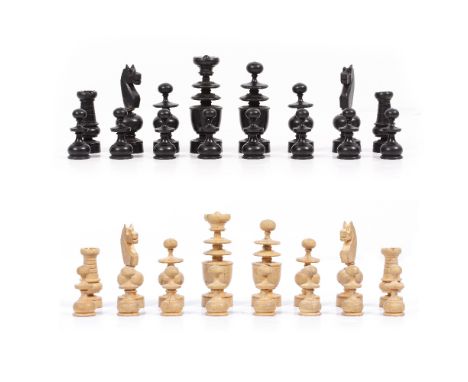 A TURNED WOODEN CHESS SET the kings 8.5cm high Condition: the four knights possibly reglued, one knight with a split to the b