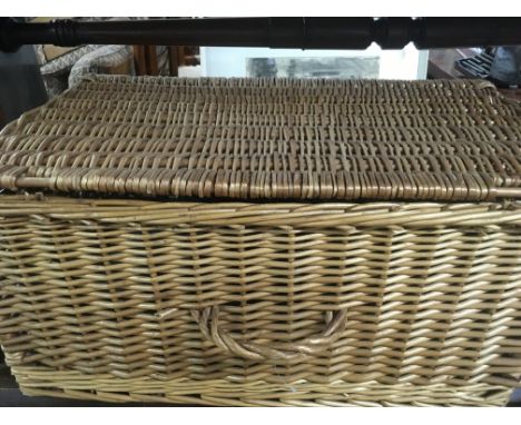 A wicker basket containing tools