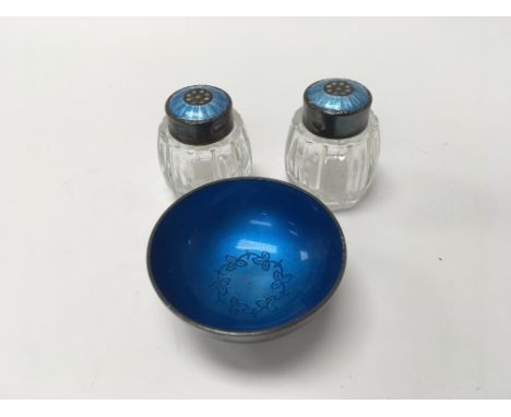 A pair of small glass perfume bottles with silver and enamel lids 3 cm and a small silver and enamel bowl ( unmarked)