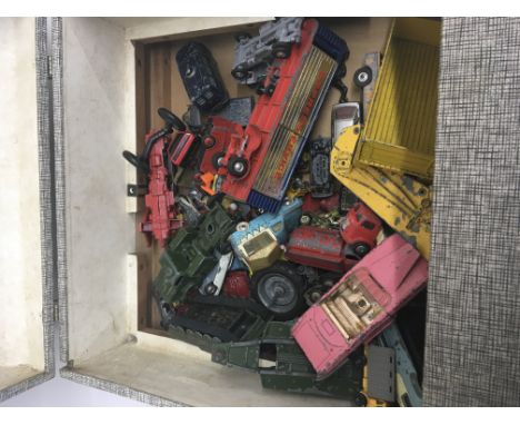 A collection of playworn die-cast cars. All in an old record player cabinet.