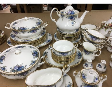 A Royal Albert moonlight rose dinner service comprising tureens dinner plates meat plate twin handle bowls desert dishes serv